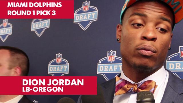 Dion Jordan, defensive end from Oregon, holds up a Dolphins Jersey after  the Miami Dolphins select him as the #3 overall pick in the 2013 NFL Draft  at Radio City Music Hall