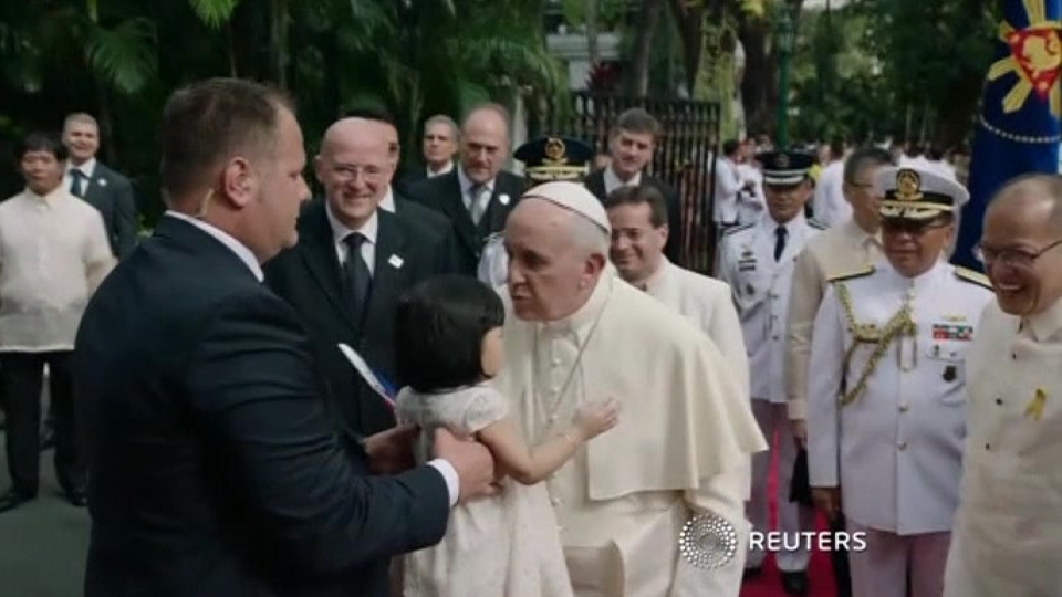 Pope welcomed in Philippines, kisses babies