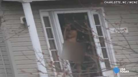 Naked neighbor defends bare doorway pose image