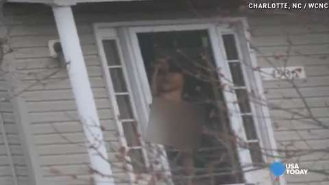 Naked neighbor defends bare doorway pose