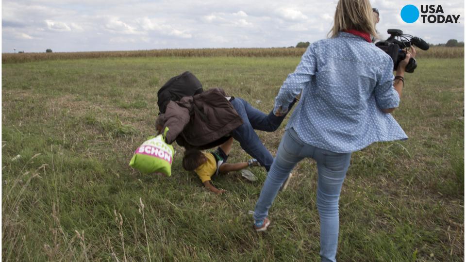 TV camerawoman fired after kicking, tripping migrants