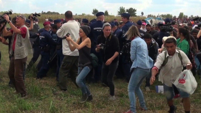 Hungarian TV camerawoman fired for kicking fleeing migrants