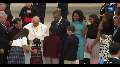 Pope Francis greeted by Obama family after landing