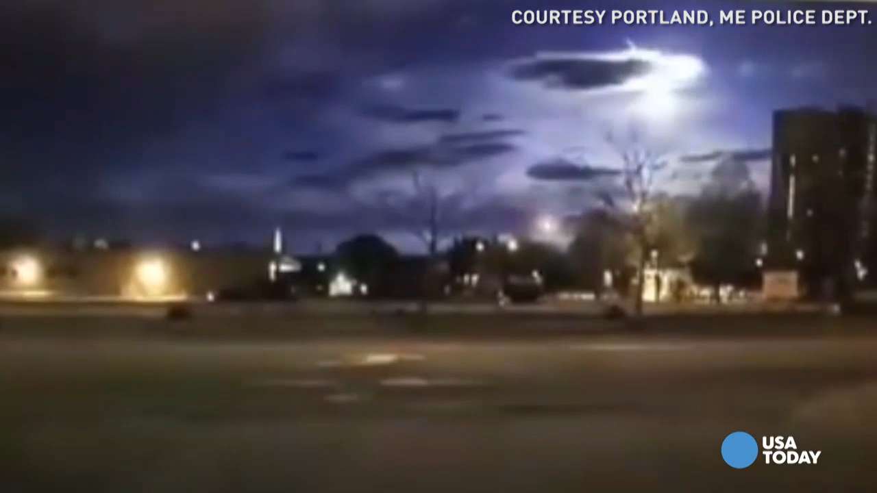 Brilliant meteor burns through sky in police cam