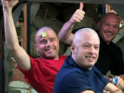 Raw: NASA astronauts shave head for USA loss