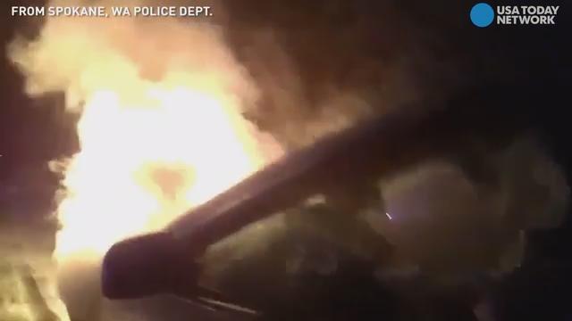 Body cam captures dramatic rescue from burning car